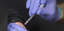 Watch a news report explaining a vaccine that was falsely administered