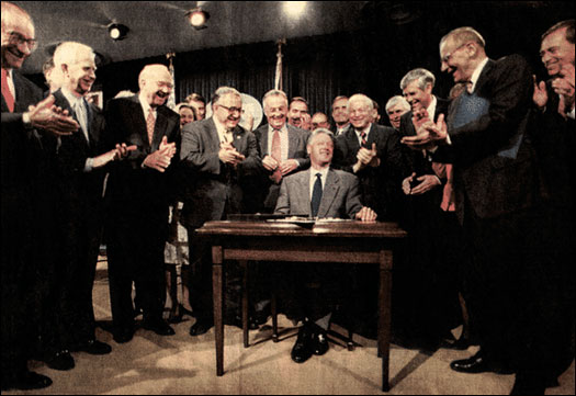 Bill Clinton signs into law the  Gramm-Leach-Bliley Financial Services Modernization Act, November 12, 1999