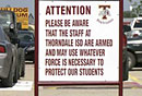 Some school districts have been arming their faculty to protect their students, but many post obnoxious signs advertising that fact